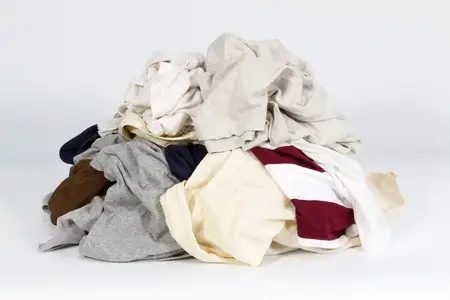 pile of old clothes on white background