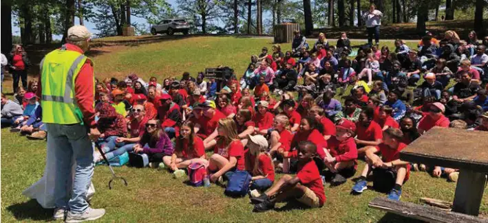 Students listening to John Thompson with the Lake Martin Resource Association.